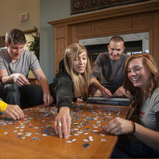 Students putting together a puzzle