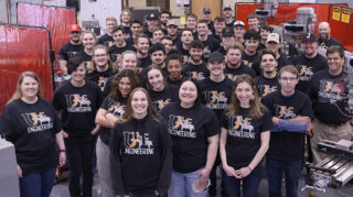 Engineering students and faculty pose for a photo