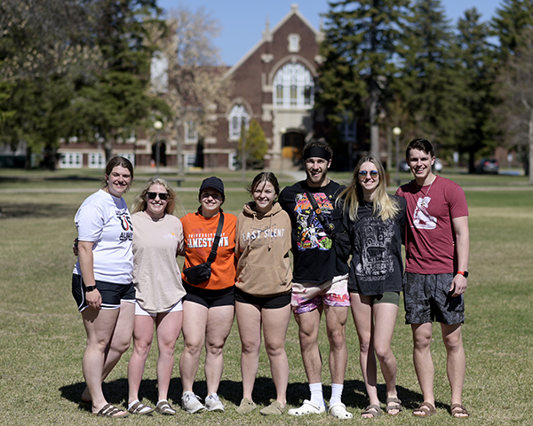 A group of students pose for a photo before leaving campus at the end of the spring 2023 semester. 