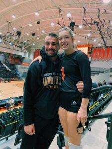 Jack and Hannah in the bleachers of the basketball court