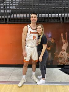 Jack and Hannah at the edge of the basketball court