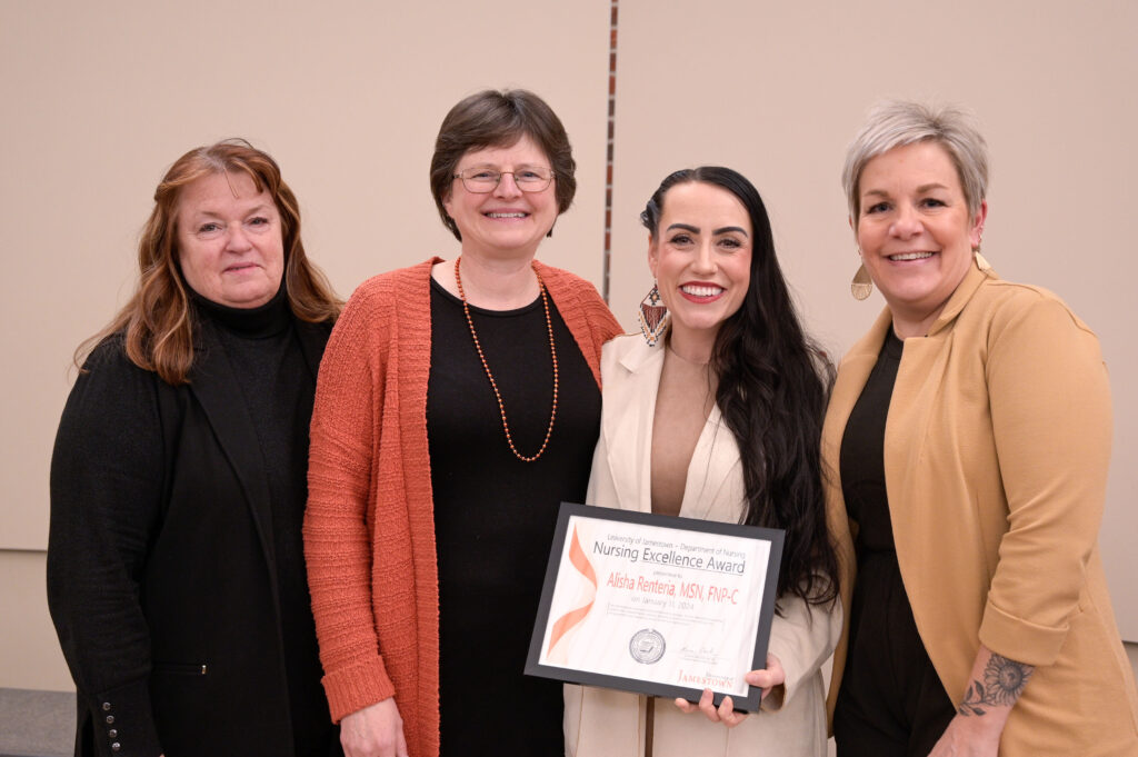 Nursing Faculty presenting award to Alisha Sandidge-Renteria.