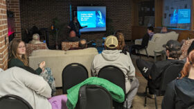 Associate Professor of Engineering at University of Jamestown Cherish Bauer-Reich gives a presentation on auroras during a Faculty Fireside Chat at UJ.