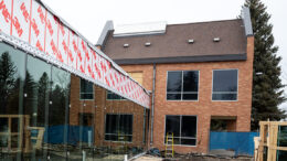 Orange-brick building with construction work.