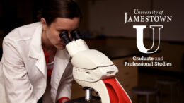 A woman in a white laboratory coat looks through the ocular lenses of a microscope. The words 