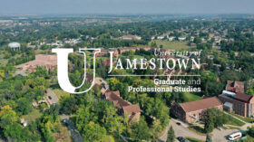 Aerial photo of college campus with trees and red brick buildings. The words 