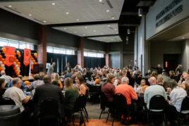 Photo of a crowded room during homecoming event