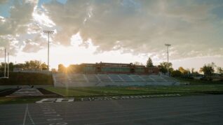 Sun rises over football stadium